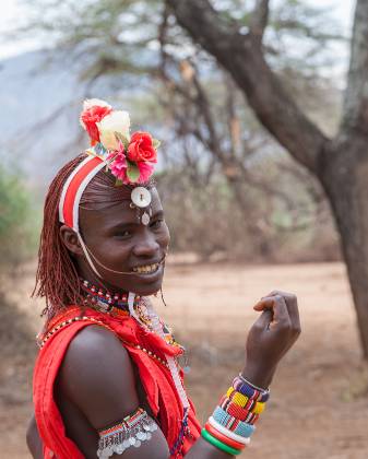 Maasai Portrait 2 Maasai warriors are often recognized by their distinctive attire, which includes bright red shuka (blankets or cloths) wrapped around their bodies. They also...