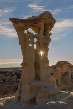 The Alien Throne Sunburst The sun seen though the Alien Throne Hoodoo in Valley of Dreams, New Mexico