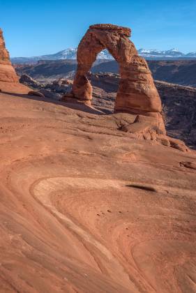 Delicate Arch seen from The Bowl Delicate Arch in Arches NP seen from The Bowl