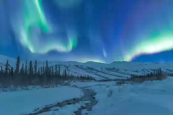Aurora over Open Water Aurora over open water on the Dietrich River in Northern Alaska.
