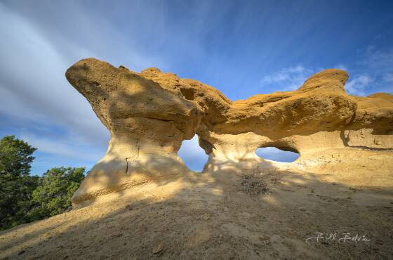 Caballo Canyon Triple Arch 3 Caballo Canyon Triple Arch at dawn seen near Aztec, New Mexico.
