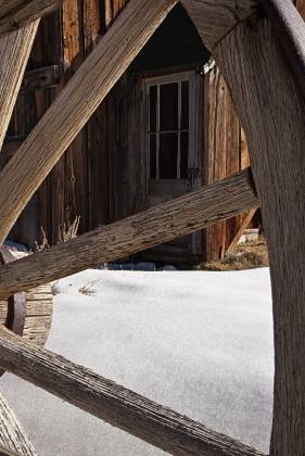 Wagon Wheel framing Door Wagon Wheels in Bodie State Historical Park, California