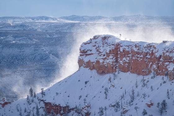 Snow blowing off Bryce Point Bryce Point in Bryce Canyon as seen from SuNset Point in the winter