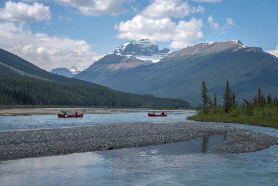 Canoeists on the Saskatchewan River View of canoeists on the Saskatchewan River in Banff National Park