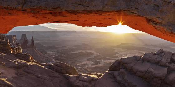 Mesa Arch in January Sunburst seen through Mesa Arch in December