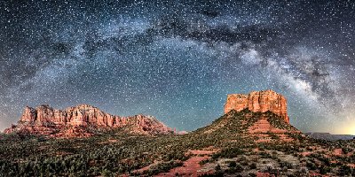 Milky Way Majesty Panorama of Bell Rock, Courthouse Butte, Lee Mountain, Gibraltar Rock, and Twin Buttes at night under a full arc of the Milky Way in Sedona, AZ