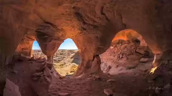 Four holes shown Colonnade Arch, also knowqn as Five Hole Arch, in Utah