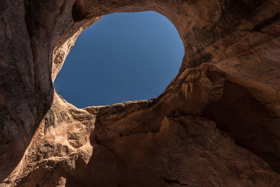 Looking up Colonnade Arch, also knowqn as Five Hole Arch, in Utah