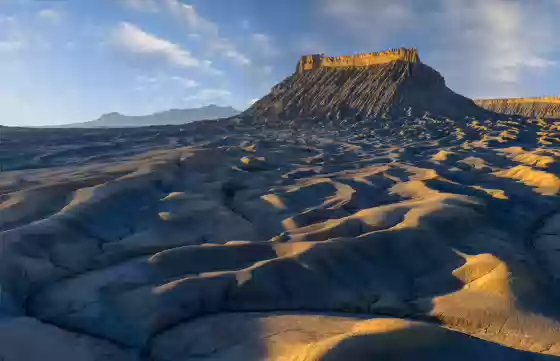 Factory Butte Aerial at Sunrise 3 Factory Butte at Sunrise. Henry Mountains and North Caineville Mesa in the background.