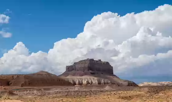 Clouds over WIld Horse Butte Dramatic clouds seen over WIld Horse Butte in Goblin Valley State Park. Image taken at the Three Sisters Pullout.