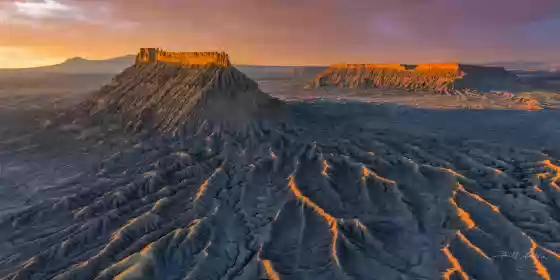 Factory Butte Aerial at Sunrise 4 Factory Butte at Sunrise. Henry Mountains and North Caineville Mesa in the background.