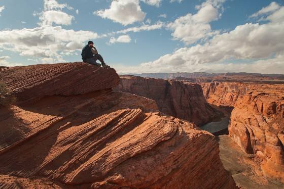 Contemplation Man looking at the Colorado River at Horseshoe Bend near Page, Arizona
