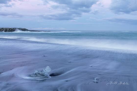 Jokulsarlon Ice Bearch Runoff Ice Beach in Iceland refers to Jökulsárlón Beach, also known as Diamond Beach. This stunning beach is near the Jökulsárlón glacial lagoon in the Vatnajökull...