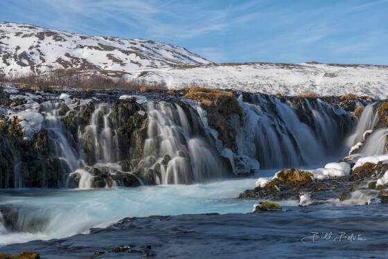Bruarfoss No 2 The striking blue color of Bruarfoss comes from the glacial meltwater that feeds the river. The water passes through layers of lava rock, and the interaction...