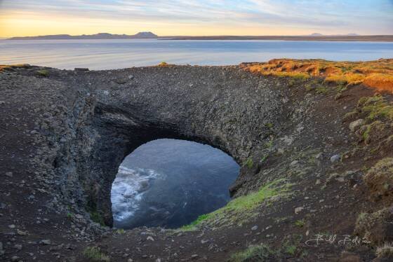 Raudanes Coastal Arch Raudanes Coastal Arch, also known as Gluggar (Window in English) on Raudanes Cape, Iceland. 65 foot span. The hole is visible on Google Maps.
