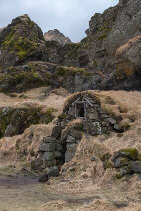 Drangshlid 2 Drangshlid, an old farmhouse with a turf roof near Skogafoss in Icelend.