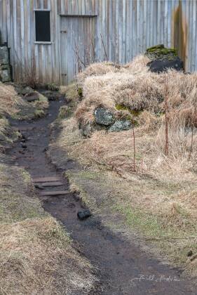 Drangshlid 3 Drangshlid, an old farmhouse with a turf roof near Skogafoss in Icelend.