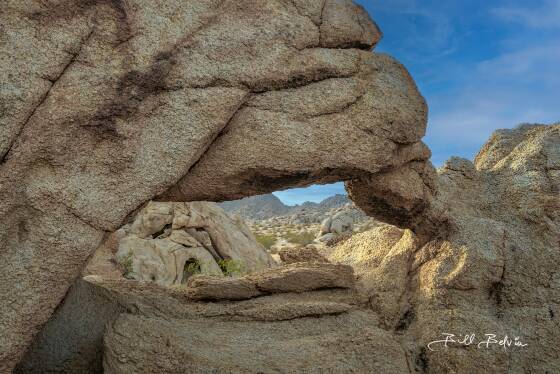 Arch over arch Arch over arch in northeast Joshua Tree NP has span of about 5 feet. It frames the arch in the background.