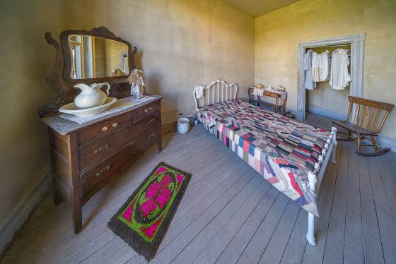 Room in the Meade Hotel 1 Normally behind glass, briefly opened by the park ranger for us, a room in the Meade Hotel in Bannack ghost town.
