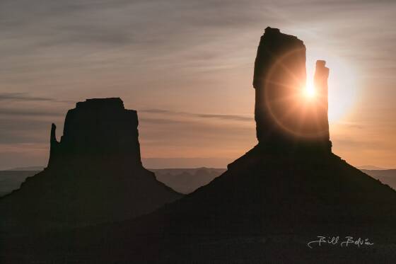 Mittens Sunburst Sun with ring flare seen peaking out from a Monumnet Valley Mitten