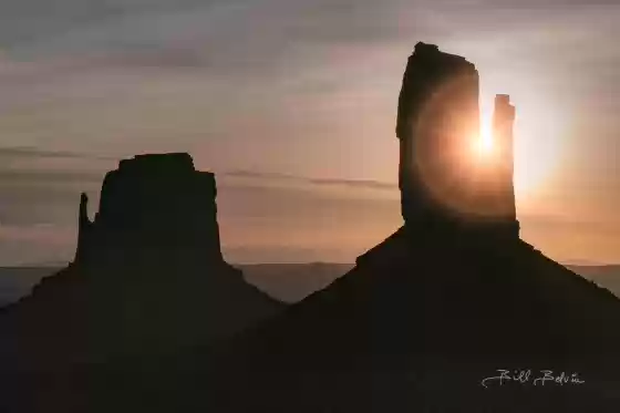 Mittens Sunburst Sun with ring flare seen peaking out from a Monumnet Valley Mitten