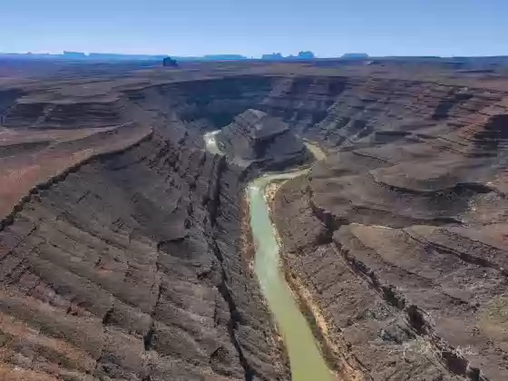 Mendenhall Loop 1 Mendenhall Loop, a bend in the San Juan River. Allhambra Rock and Monument Valley in the far distance.