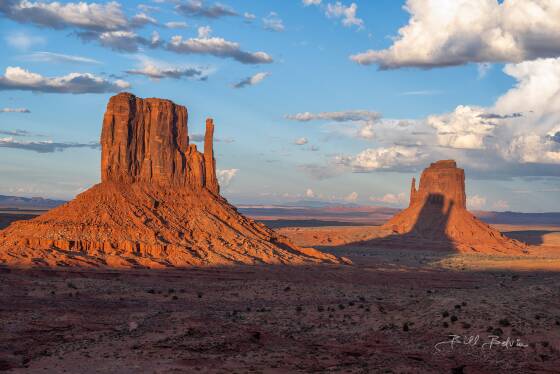 Casting a Long Shadow Twice a year Monument Valley's West Mitten casts a shadow on the East Mitten at sunset.