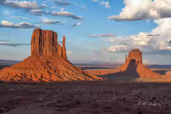 Casting a Long Shadow Twice a year Monument Valley's West Mitten casts a shadow on the East Mitten at sunset.