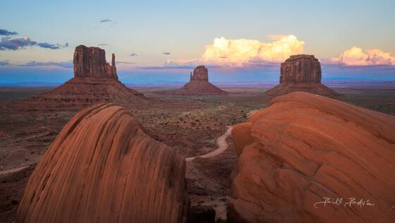 Sunset st The Mittens The MIttens and Merrick Butte seen from the Monument Valley Parking lot after sunset.