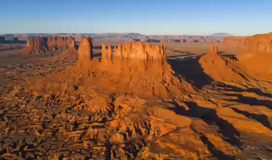 Stagecoach Butte 4 Aerial of Monument Valley showing from left ro right Sentinel Mesa, The Big Indian (merged with Sentinel) Stagecoach Butte, and King on his Throne. Image taken...