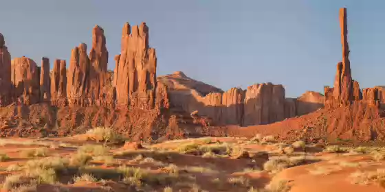 Yei Bi Chei and Totem Pole The Totem Pole and Yei Bi Chei at dawn in Monument Valley.