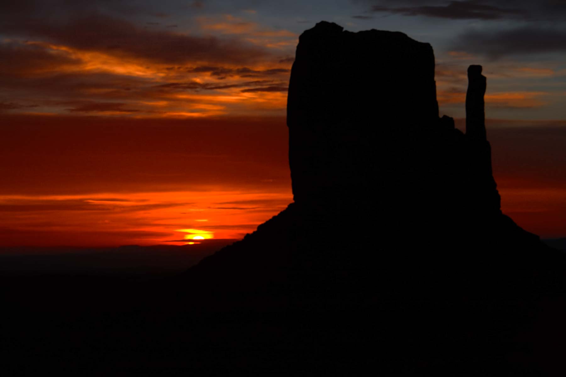 Colorful Sunrise at The West Mitten in Monument Valley