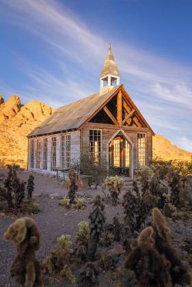 Cholla Cactus and Neslon Chapel Cholla cactus and the chapel in Nelson ghost town, Nevada.
