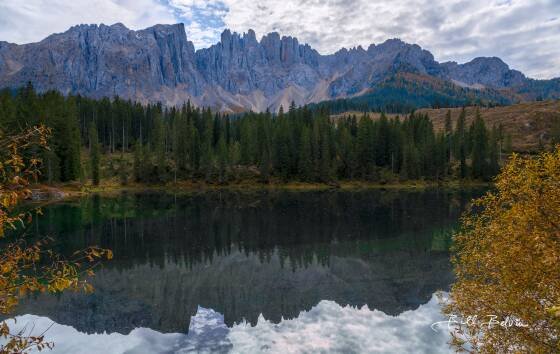 Lago di Carezza Lago di Carezza, a calm emerald green lake in the Dolomites, Italy