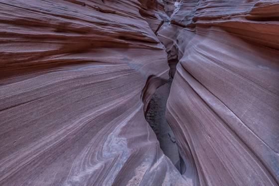 Very Narrow Slot Very narrow section of Mountain Sheep slot canyon in the Navajo Nation..