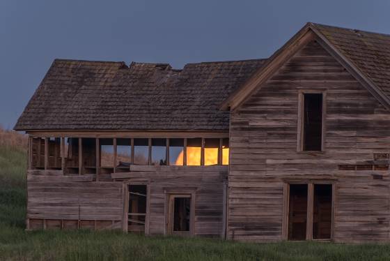 Moon in abandoned home 700mm Full Moon seen through abandoned house on Crow Rd in the Palouse
