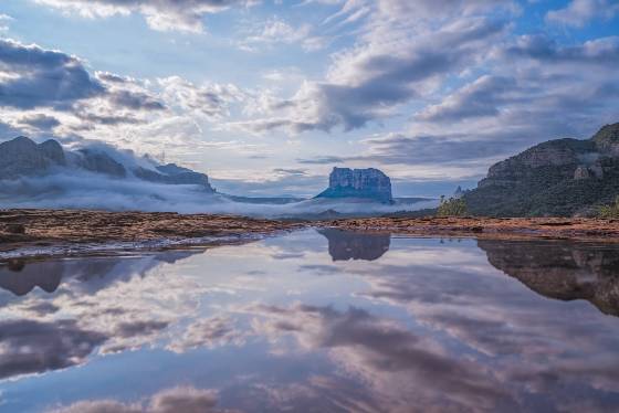 Lake Sedona Courthouse Butte reflected in water pool in Sedona, Arizona