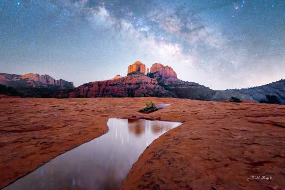 Reflecting on a Starry Night 2 The Milky Way rising over Cathedral Rock reflected in a water pool on the Secret Slickrock Trail, Sedona.