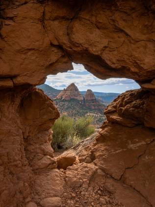 Turkey Creek Arch Arch framing two buttes seen near the Alternate Turkey Creek Trail in Sedona