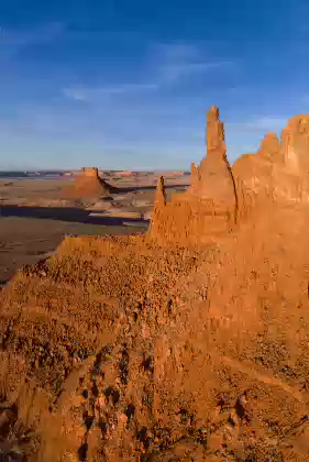 The Chinle Spires at Sunset The Badlands in front of The Chinle Spires rock formation, near Round Rock in Arizona.