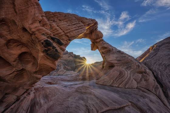 Arch Rock Sunstar Rising Sun seen from Arch Rock in Valley of Fire, Nevada
