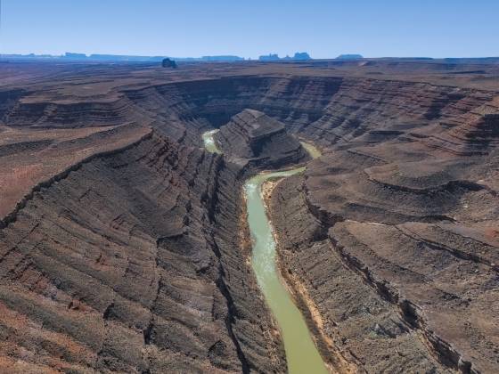 Mendenhall Loop 1 Mendenhall Loop, a bend in the San Juan River. Allhambra Rock and Monument Valley in the far distance.