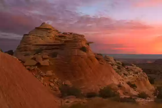 North end of the White Pocket Monolith at Dawn Hiking to The White Pocket peak at sunrise