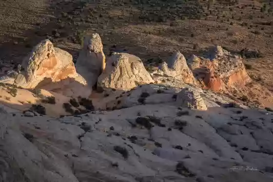 The hike up the Monolith The White Pocket peak at sunrise