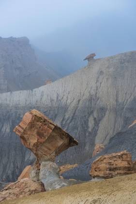 Diamond Rock in Fog Diamond shaped rock formation in the badlands along Smoky Mountain Road in Utah