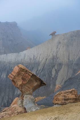Diamond Rock in Fog Diamond shaped rock formation in the badlands along Smoky Mountain Road in Utah