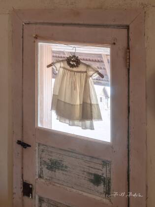 Childs Dress Childs dress seen in the brothel in Vulture CIty ghost town, Arizona.