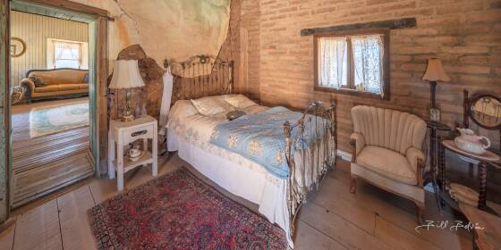Master Bedroom Panorama Master beedroom in the brothel at Vulture City ghost town, Arizona.