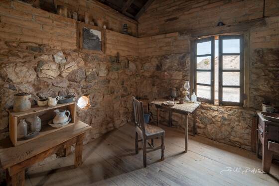 Wickenburg House 1 Interior of the Wickenburg House in Vulture City ghost town, Arizona.. THe carbide can on the left was used for ventilation and as a gun port. Carbide cans hold...