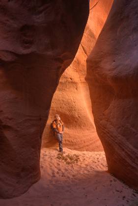 Guide Jim Anderson at the Entrance to Heart Vein Entrance to Heart Vein Canyon, also known as Upper Red Cave, near Entrance to Kanab, Utah